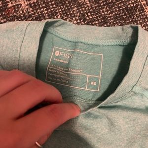 Barely worn under scrub figs sea green top